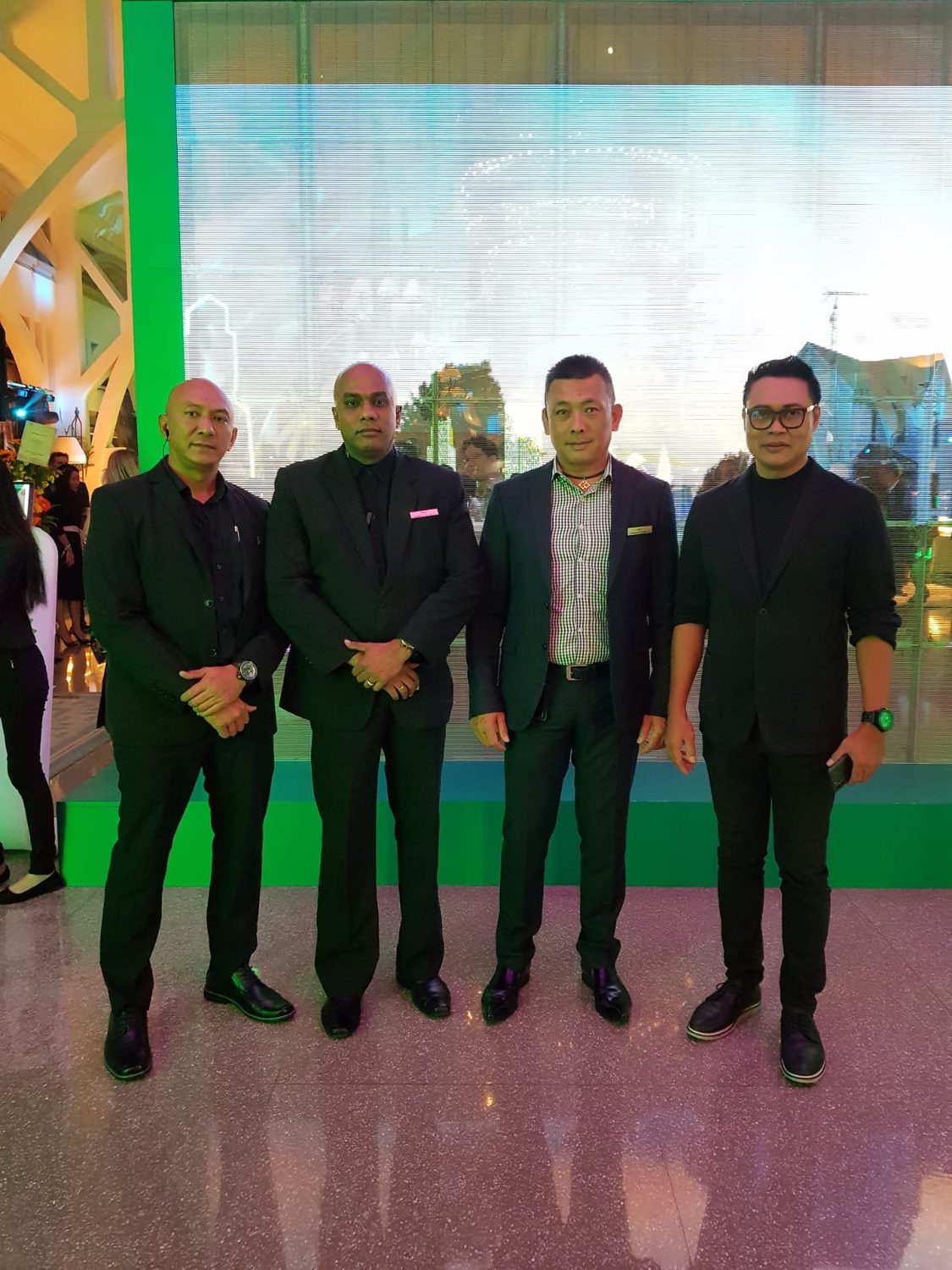 Hawkeye close-protection officers in dark suits at an event