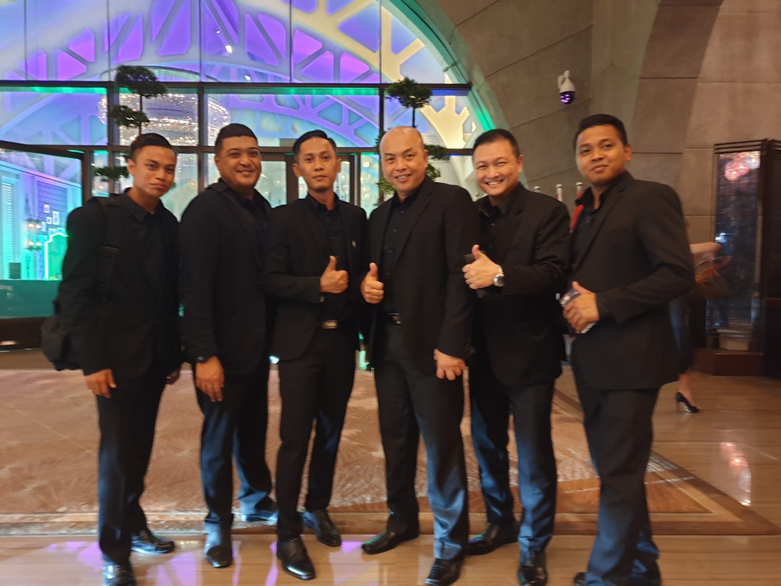 Hawkeye officers in the lobby of a five-star Singapore hotel