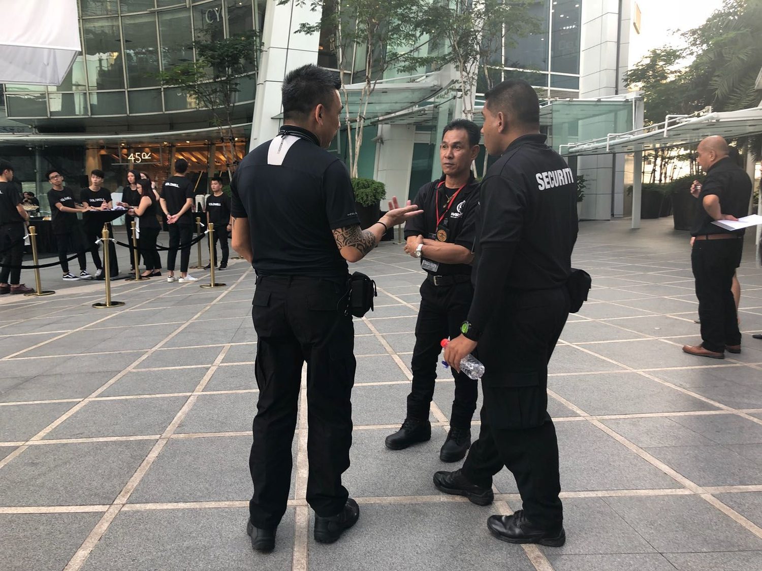 Hawkeye Security officers conferring on duty at a Singapore venue