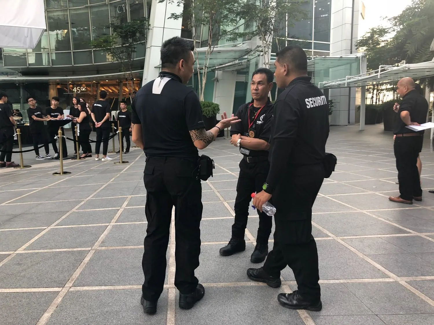 Hawkeye Security officers conferring on duty at a Singapore venue