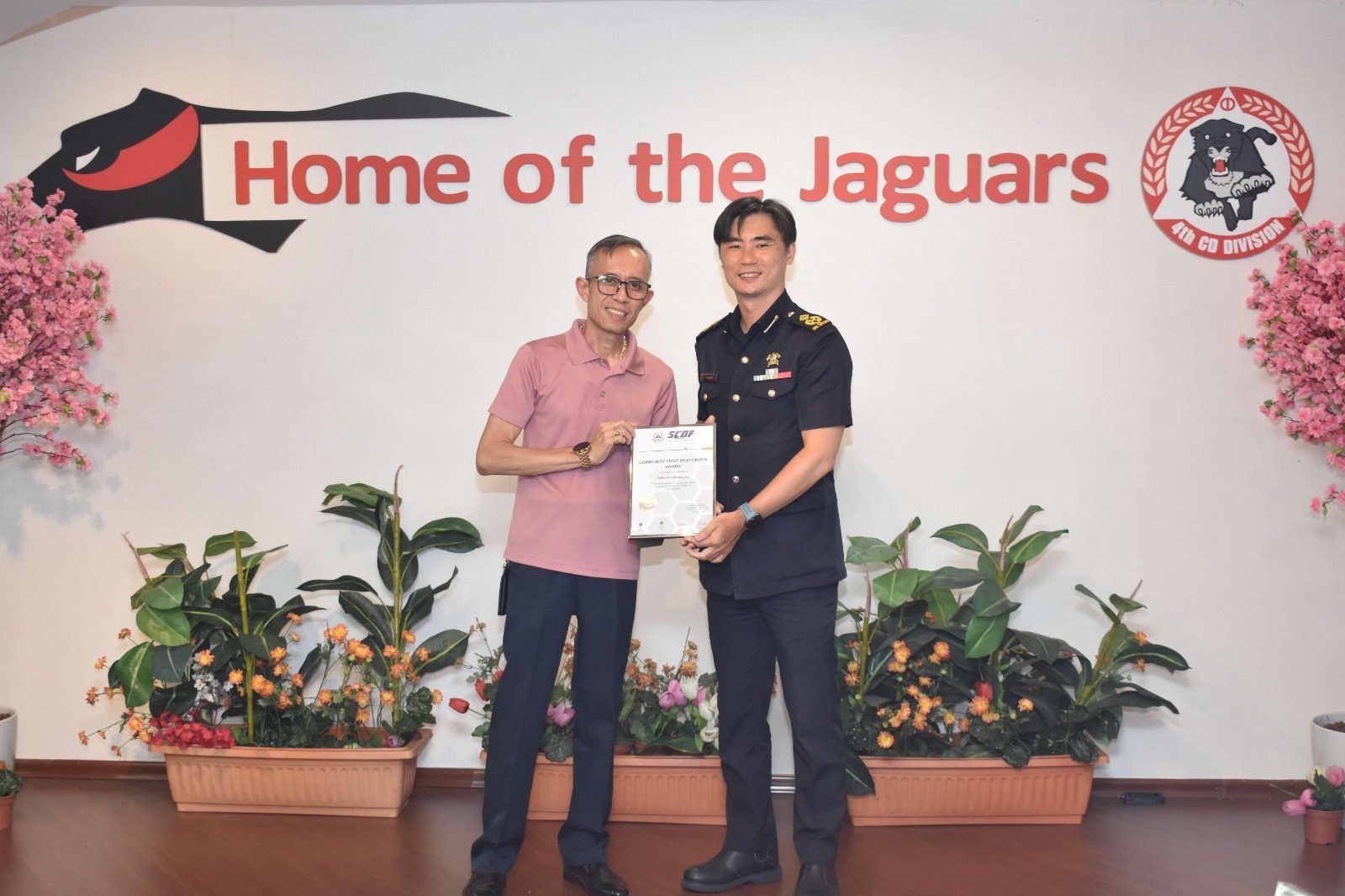 Fairuz Bin Abdul Latip receiving the SCDF Community First Responder Award at 4th SCDF Division