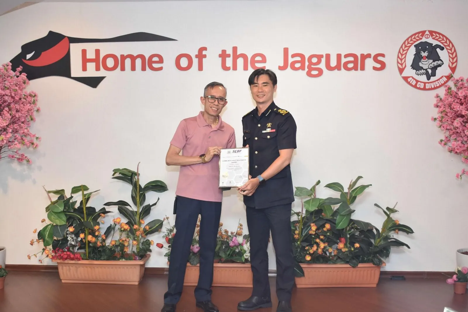 Fairuz Bin Abdul Latip receiving the SCDF Community First Responder Award at 4th SCDF Division