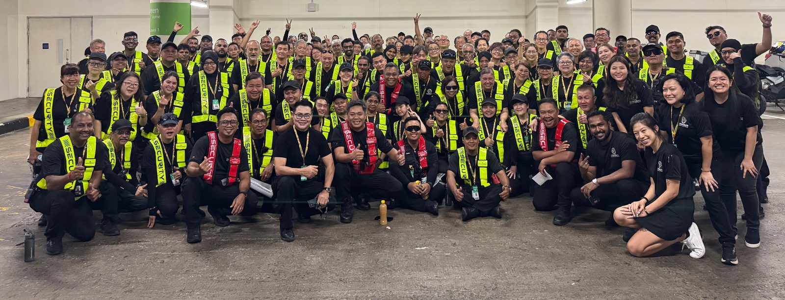 A full Hawkeye Security deployment team in hi-visibility vests at a Singapore event