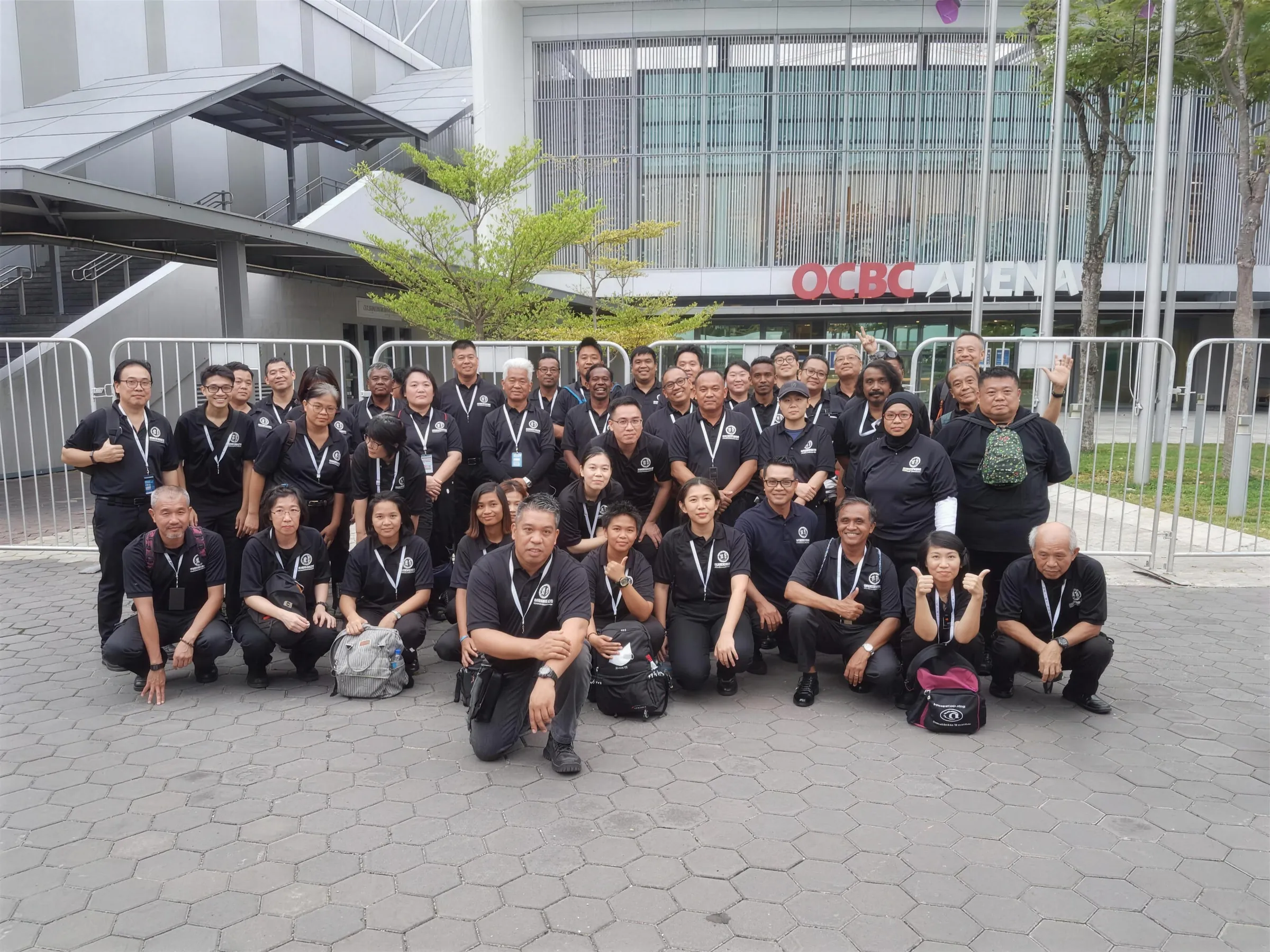 The full Hawkeye Security Solutions team assembled outside OCBC Arena at the Singapore Sports Hub